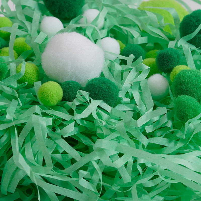 Pelota de pompón con rafia